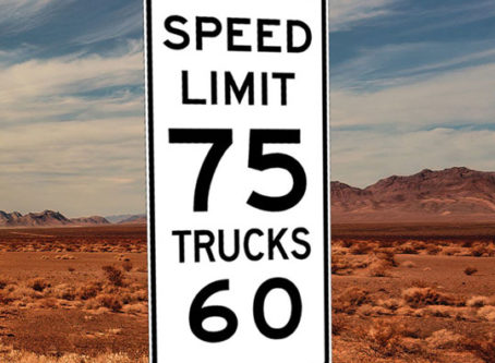 Speed limit sign showing 75 for cares, 60 for trucks