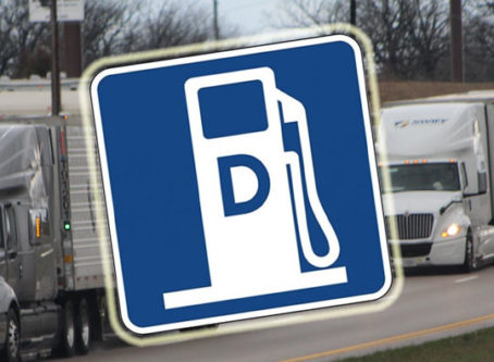 Diesel fuel symbol over semis on highway