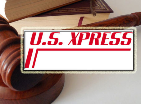 U.S. Xpress logo, gavel, lawbooks