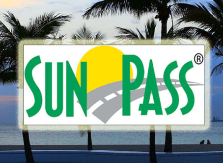 SunPass logo, palms at sunset