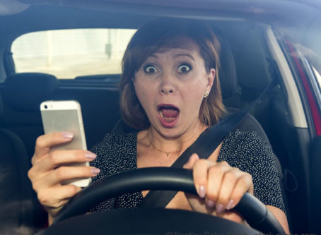 distracted driving, woman driving using cellphone