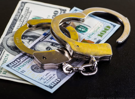 Fraud, money, handcuffs
