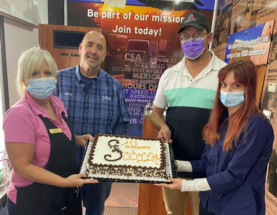 Staff at the Laurel, Mont., TA welcomed the OOIDA tour trailer with cake.