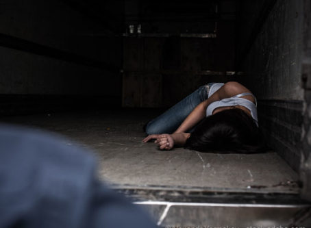 Woman in dark trailer, human trafficing victim