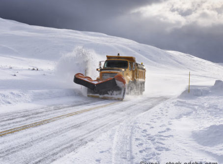 Snow plow cearing snow in Wyoming