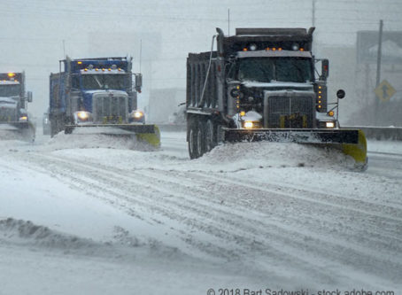 Snow plows in a blizzard, snowy winter conditions