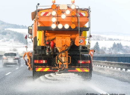 Winter storm salt truck on highway