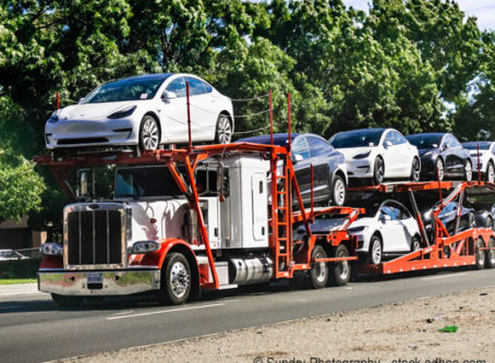 Car transporter carries Tesla Model 3 new vehicles