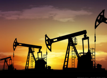 Pump jack oil field representing energy outlook