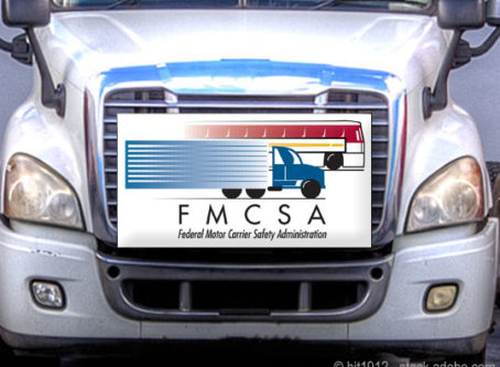 FMCSA logo, white truck grille