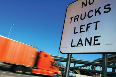 No Trucks Left Lane sign