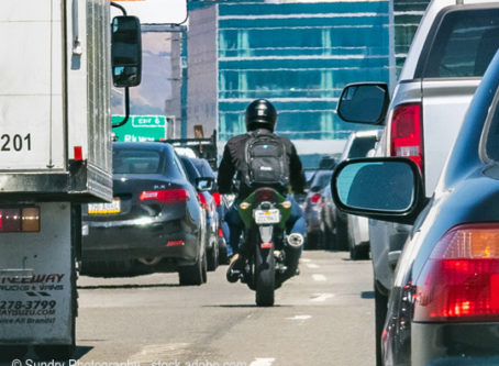 Motorcyclist lane splitting or lane filtering