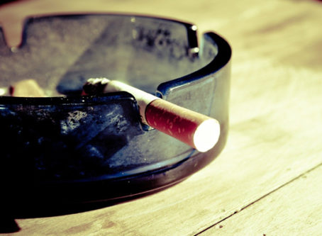 Cigarette in ashtray for Rigs Without Cigs program