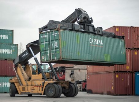 Shipping container being moved at a port