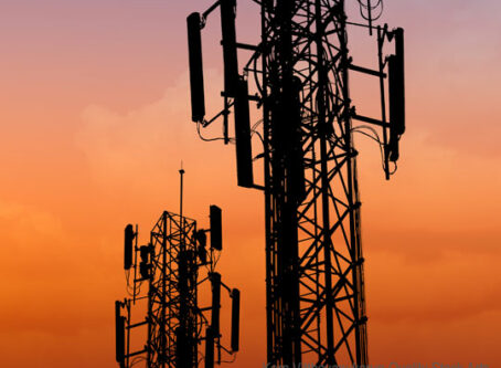 Cellular network towers, sunset. Photo by Korn Vitthayanukarun-Quality Stock Arts