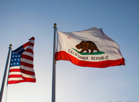 California state flag and U.S. flag. Photo by David Diaz Official