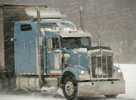 Tractor-trailer in snow and ice storm, winter driving