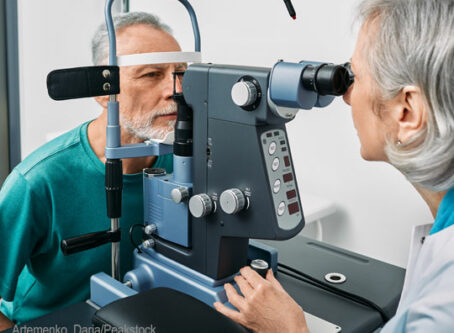 Vision test by optometrist, photo by Peakstock