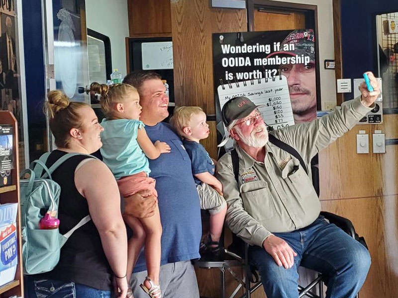 OOIDA Board Member Doug Smith snaps a group selfie in the OOIDA tour trailer (Photo by Marty Ellis)