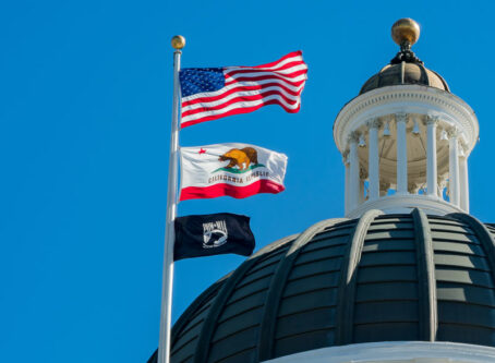 AB5 webinar hints at how law will apply to trucking. California capitol, flag photo by Kit Leong