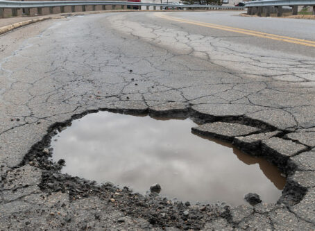 Potholes, best and worst roads. Photo by Christian Delbert