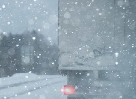 Snow, blizzard on highway. Image by scharfsinn86