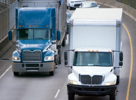What’s going on with the speed limiter proposal? Two trucks side by side iamge by Vit