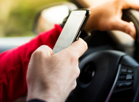 Distracted driving, texting and driving. Photo by JRP Studio