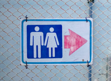 Restroom sign on metal plate. Photo by sbo.ow-j