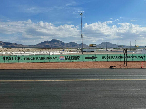 Signs at the We Realize truck parking facility at Las Vegas Motor Speedway